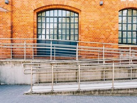 ADA-compliant concrete access ramp installed by experienced Seattle WA concrete contractor for commercial building