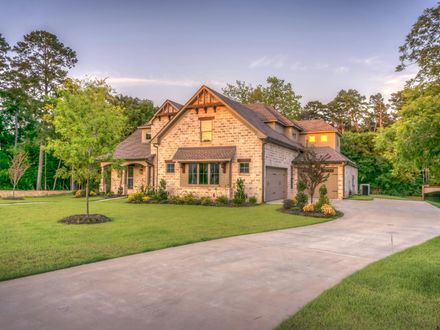 Seattle WA concrete contractor expertly installing a smooth, durable concrete driveway for luxury home