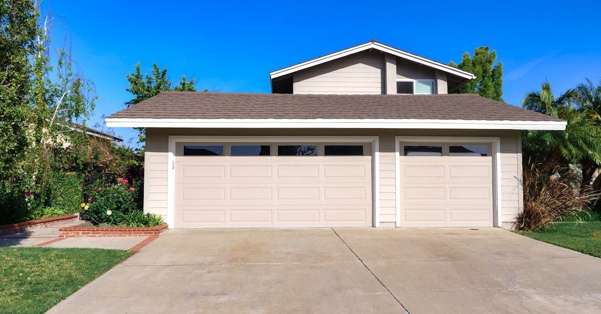 Elegant house showcasing clean driveway lines created by Seattle’s top concrete driveway contractors