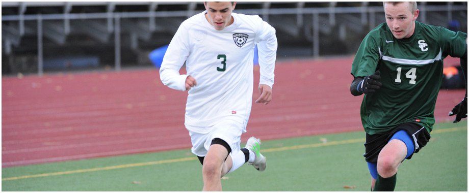A soccer player wearing a white jersey with the number 3 on it