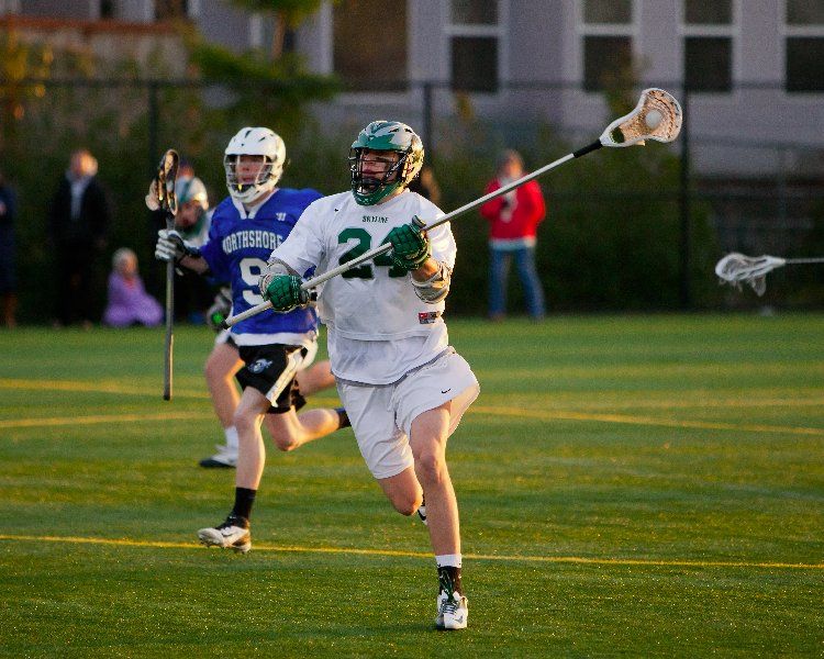 A lacrosse player with the number 24 on his jersey