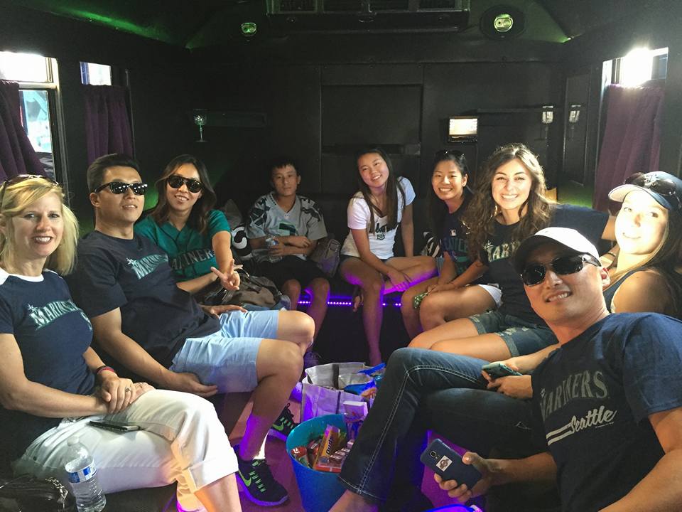 A group of people are sitting in a limousine.