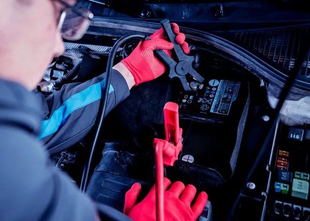 Inspecting Car Battery — Mechanical Repairs in Darwin, NT