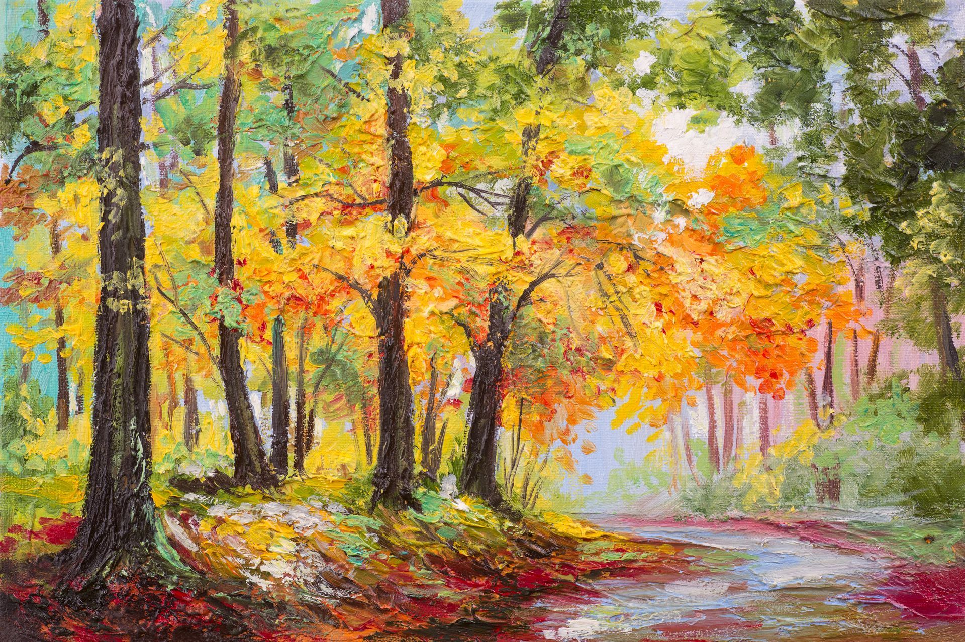Autumn forest scene: trees with yellow and orange leaves, a path winding through the woods.