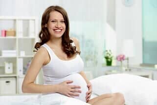 Pregnant Woman Smiling — Gynecology in Mchenry, IL