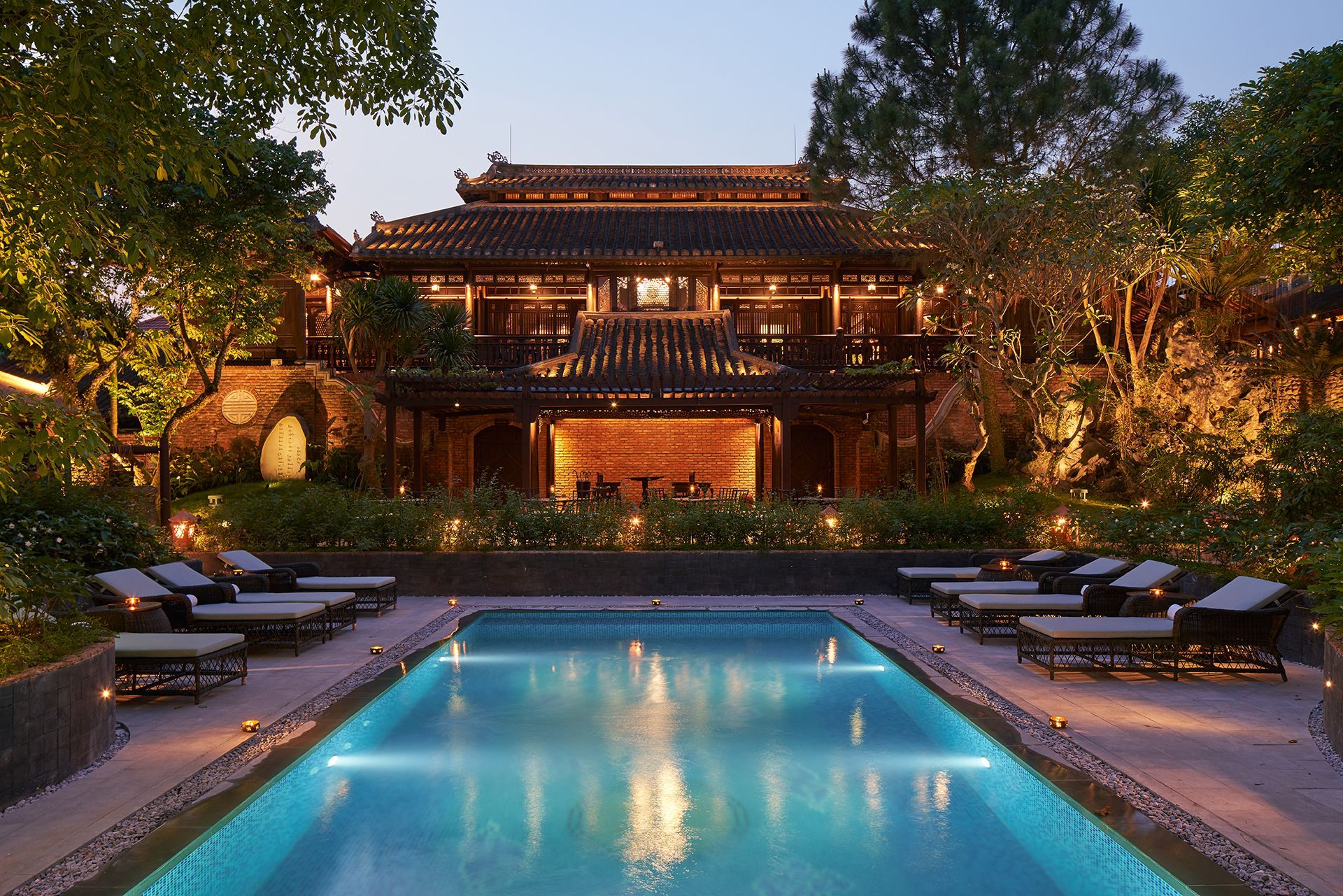 A large house with a swimming pool in front of it in Vietnam