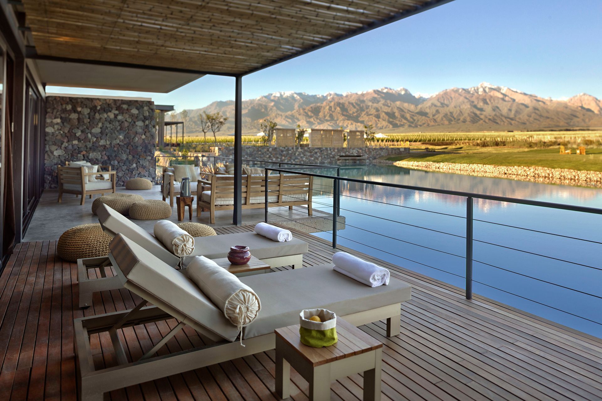 A deck with lounge chairs and mountains in the background in Argentina