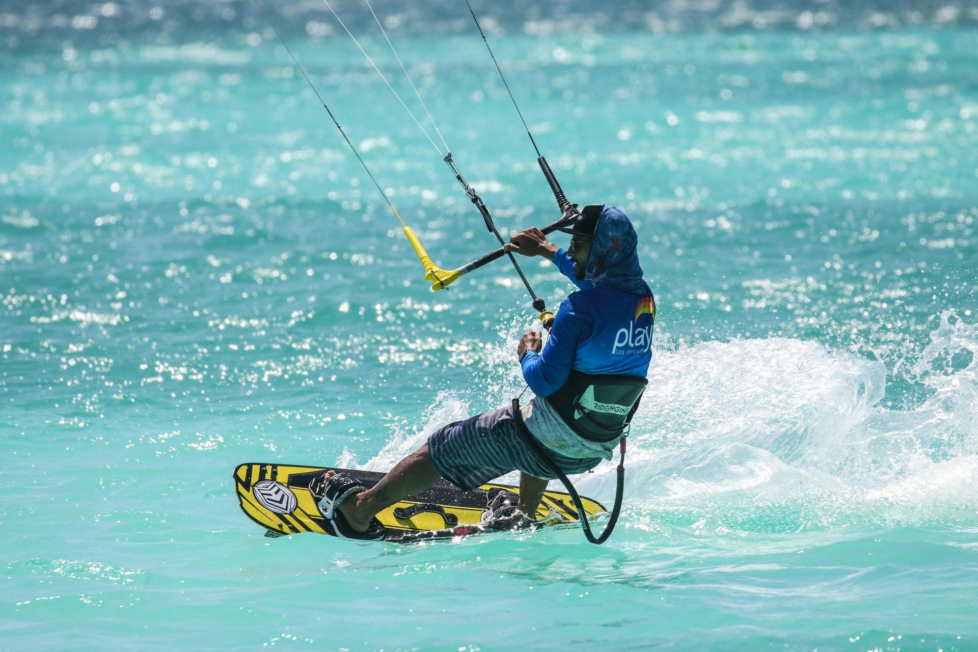 A man is riding a surfboard in the ocean.
