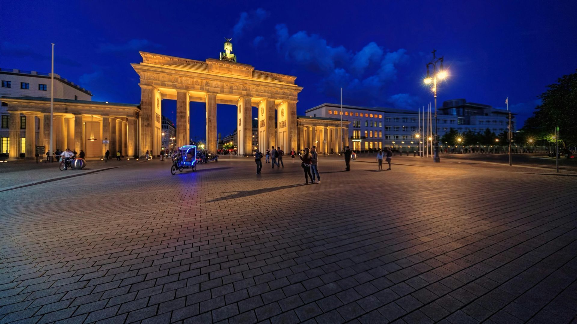 A group of people standing in front of Brandenburg Gate