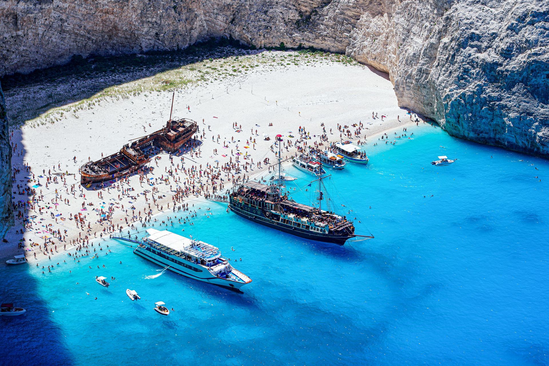 An aerial view of a beach with boats in the water Zante