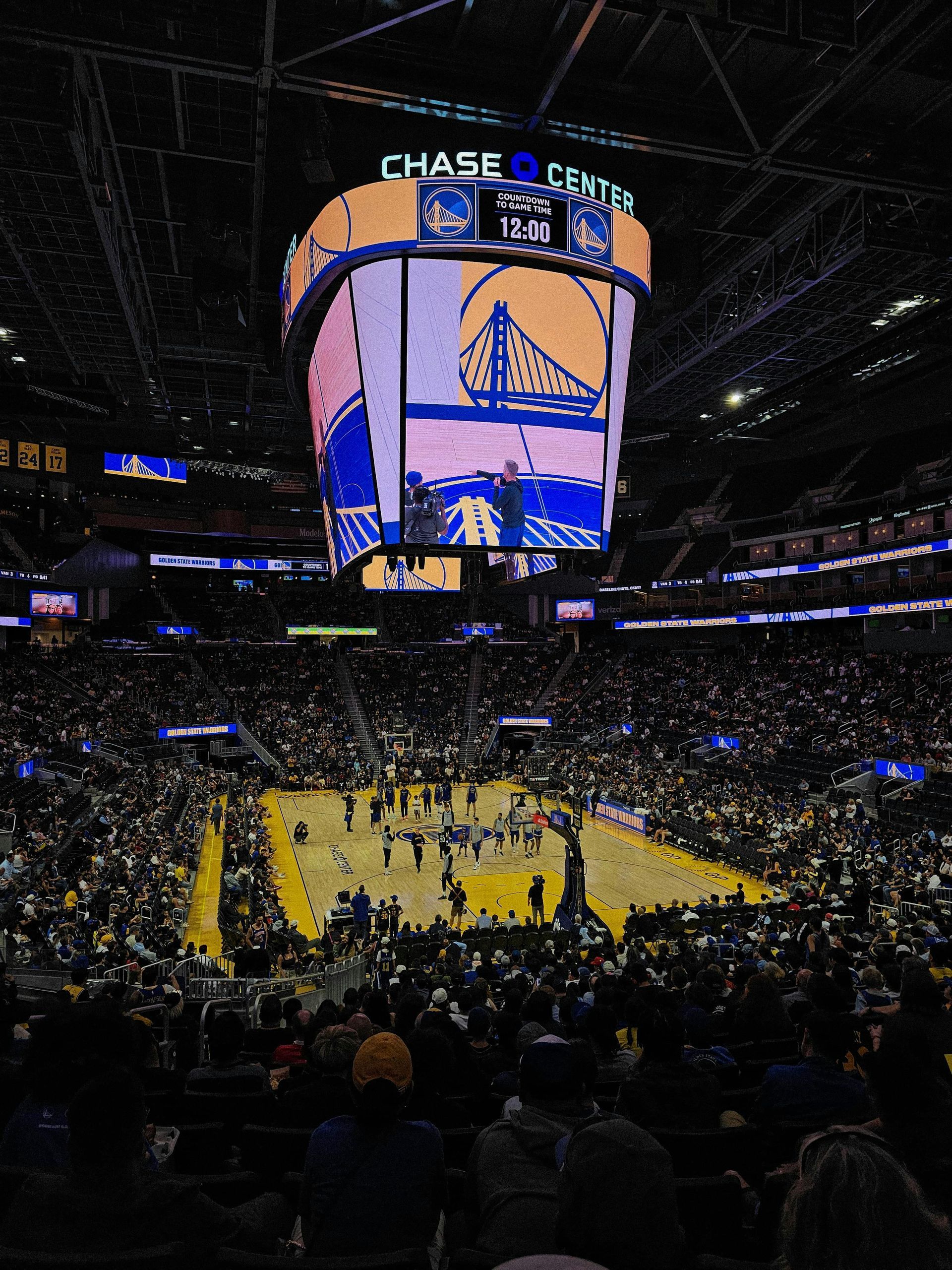 A basketball game is being played at the chase center in the NBA