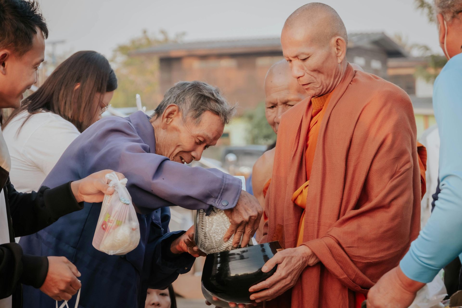 Meeting monks in Thailand with offering