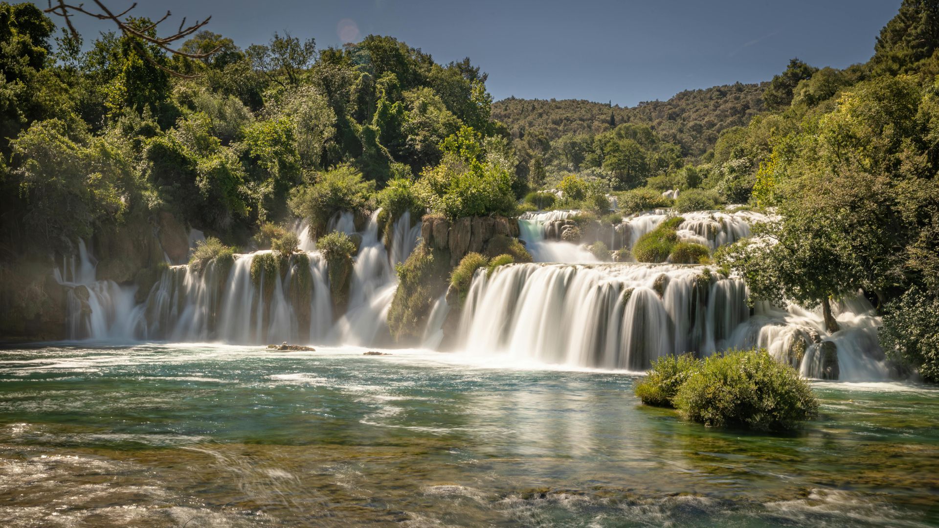 A waterfall in the middle of a river in National Park near Šibenik
