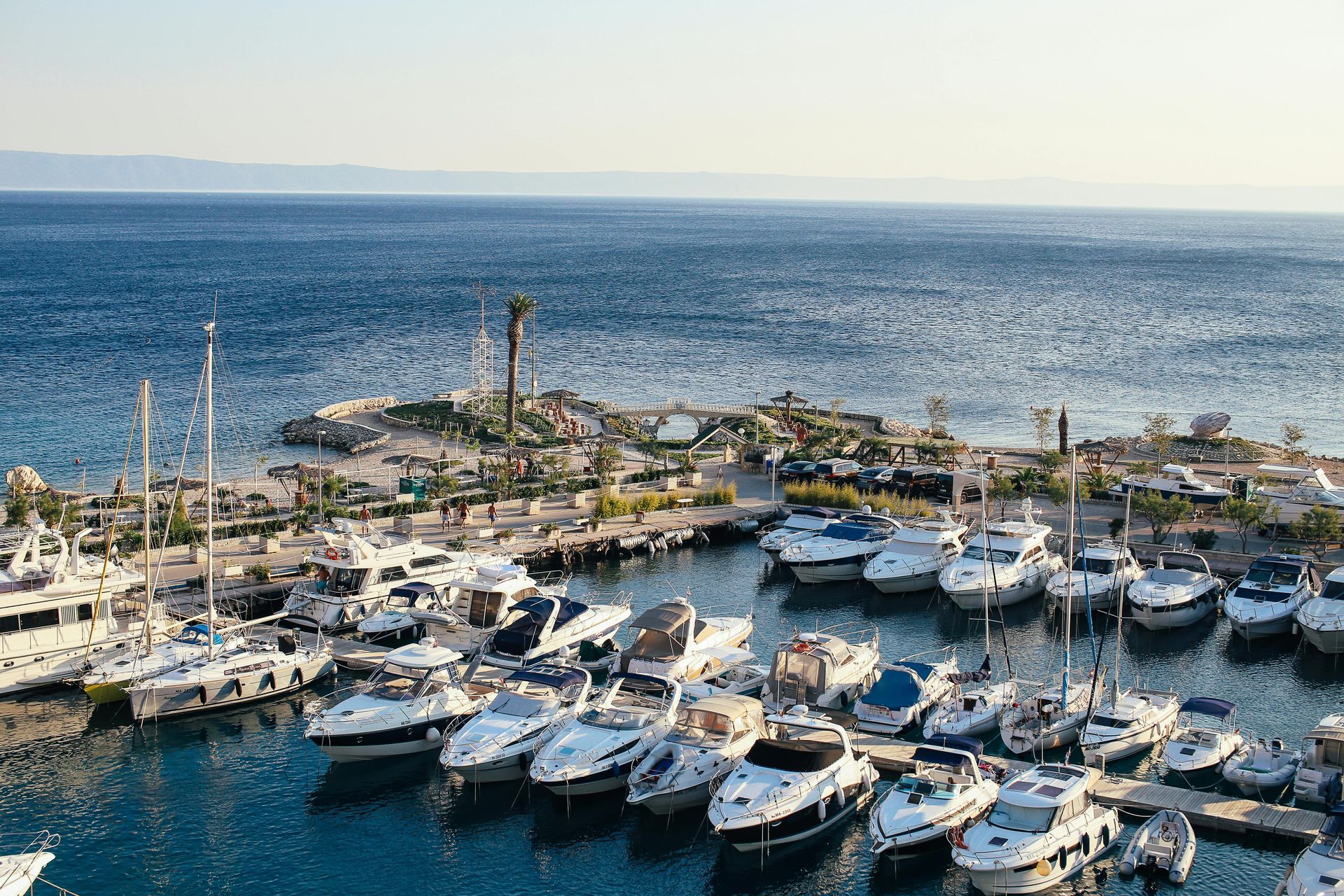 A bunch of boats are docked in the city of Split marina.
