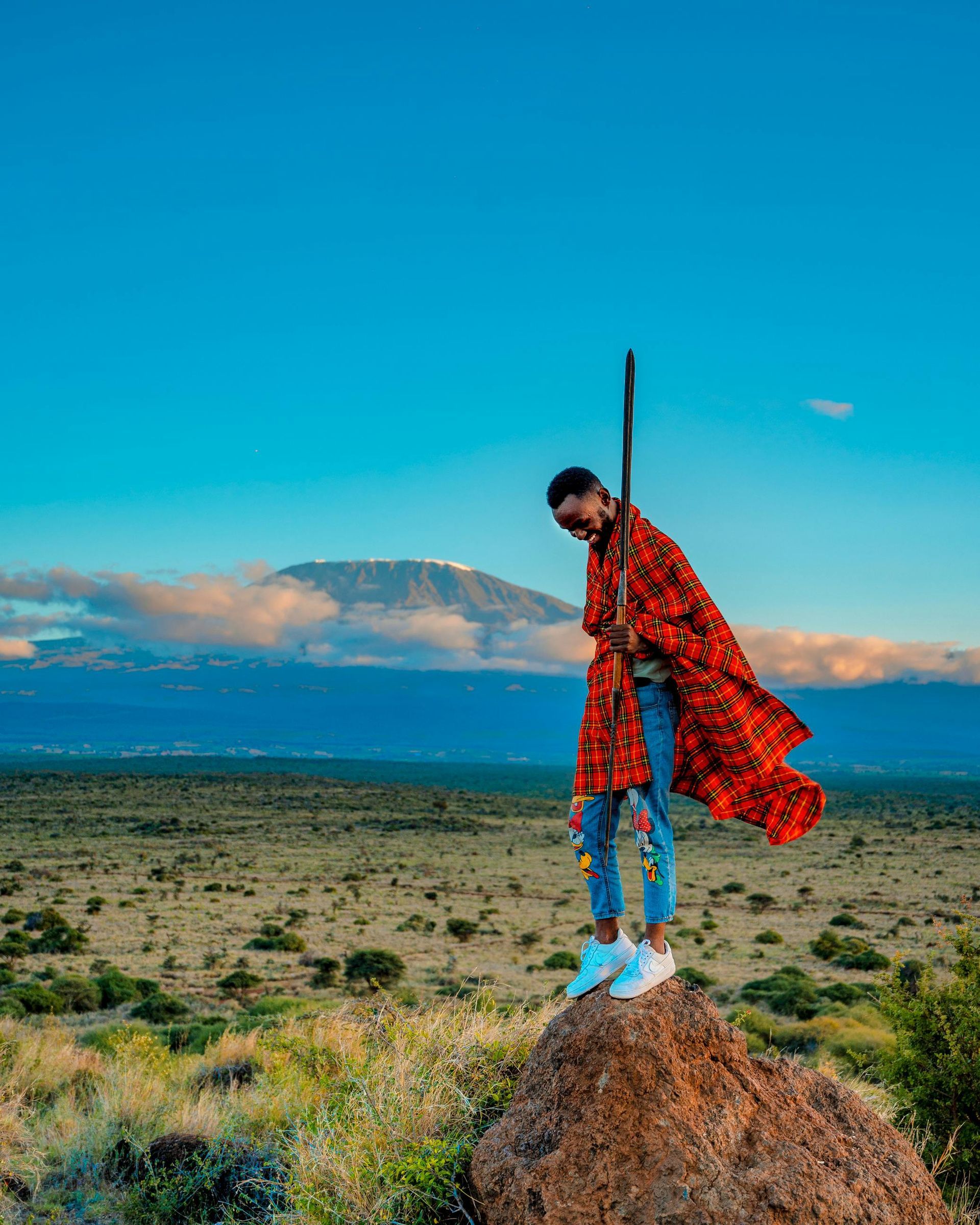 A Kenyan local with the view of Mount Kenya behind