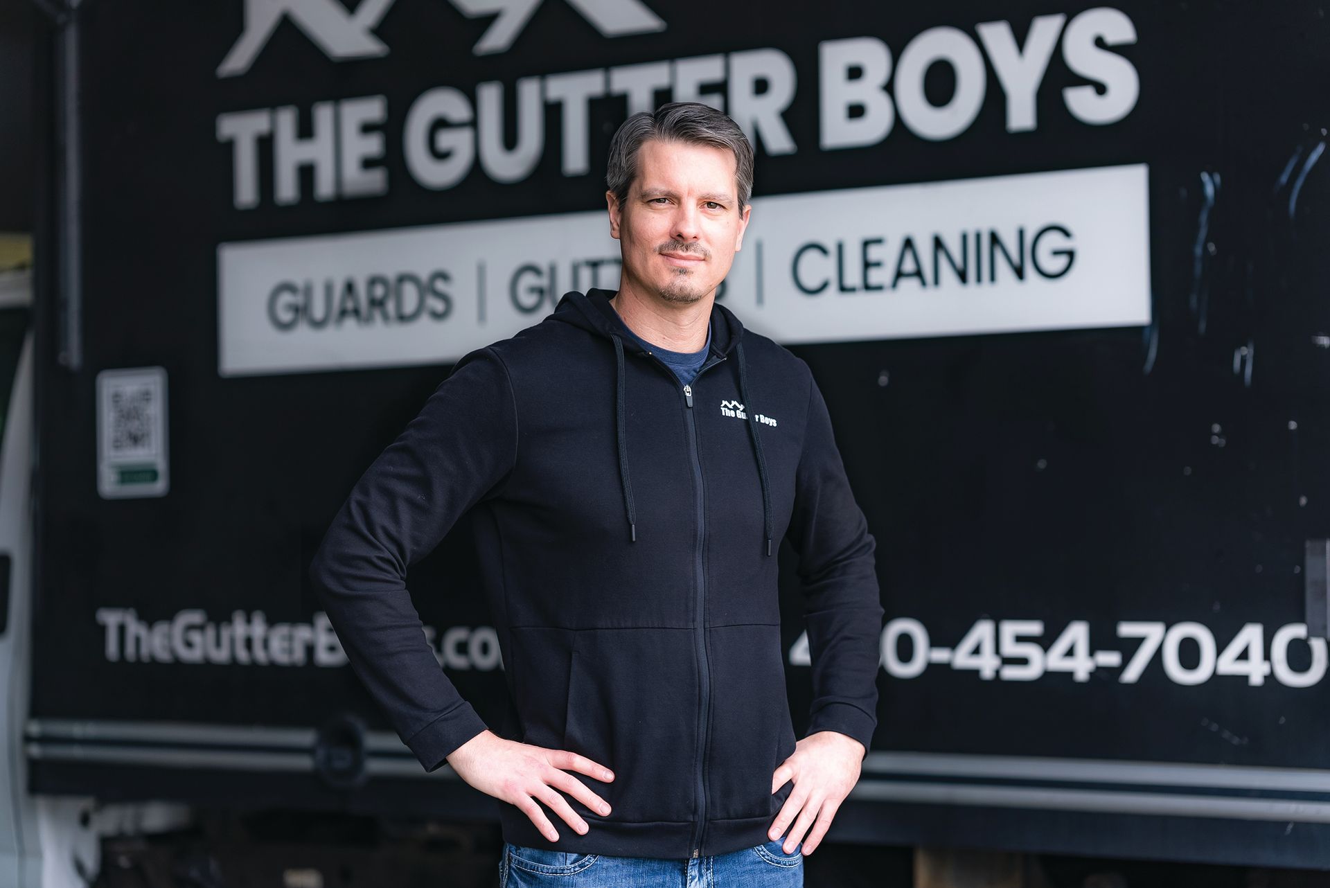 A large, weathered, vintage-style metal sign reading