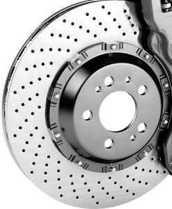 A close up of a brake disc with holes in it | 