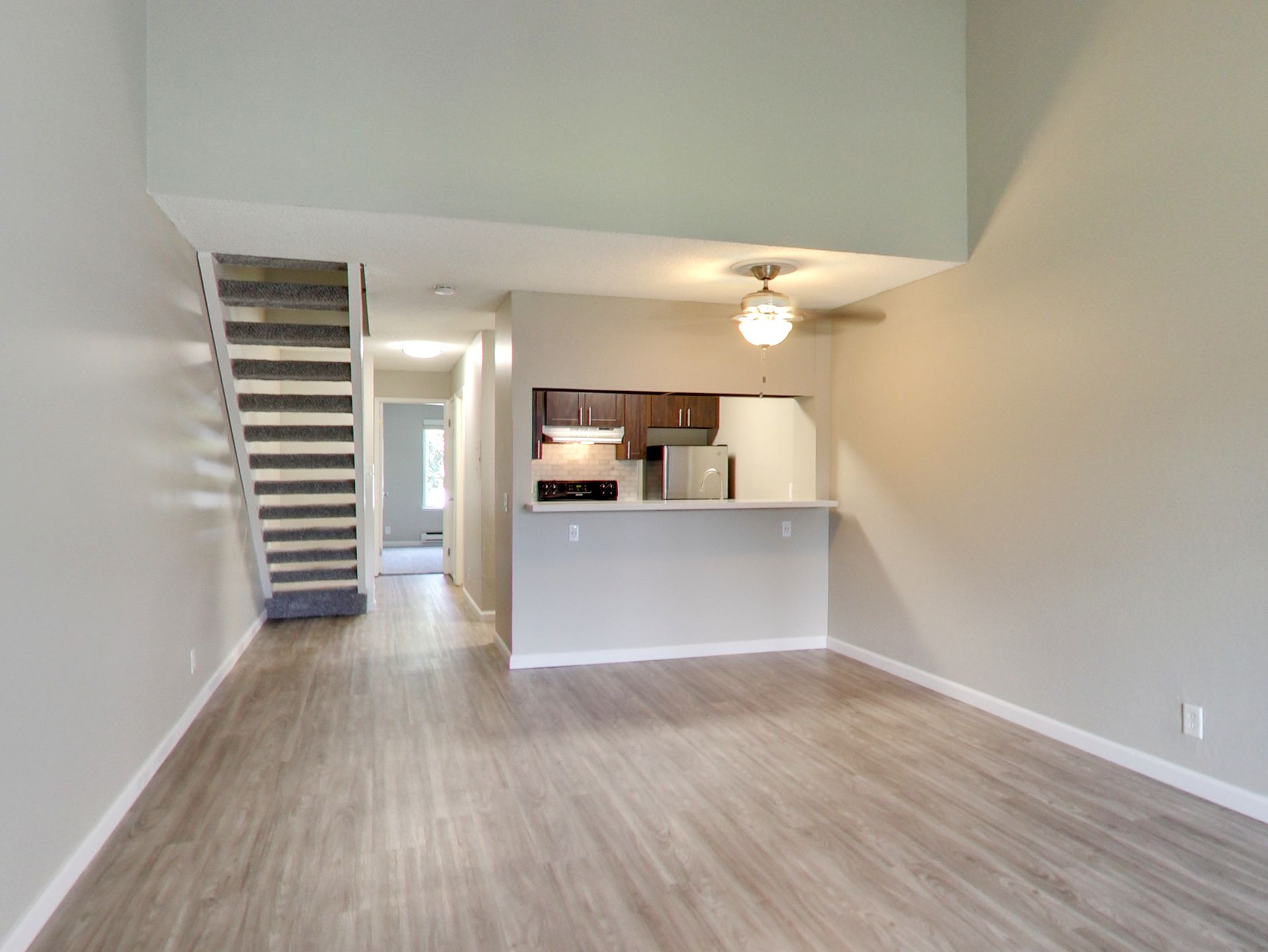living room and open concept kitchen and stairs