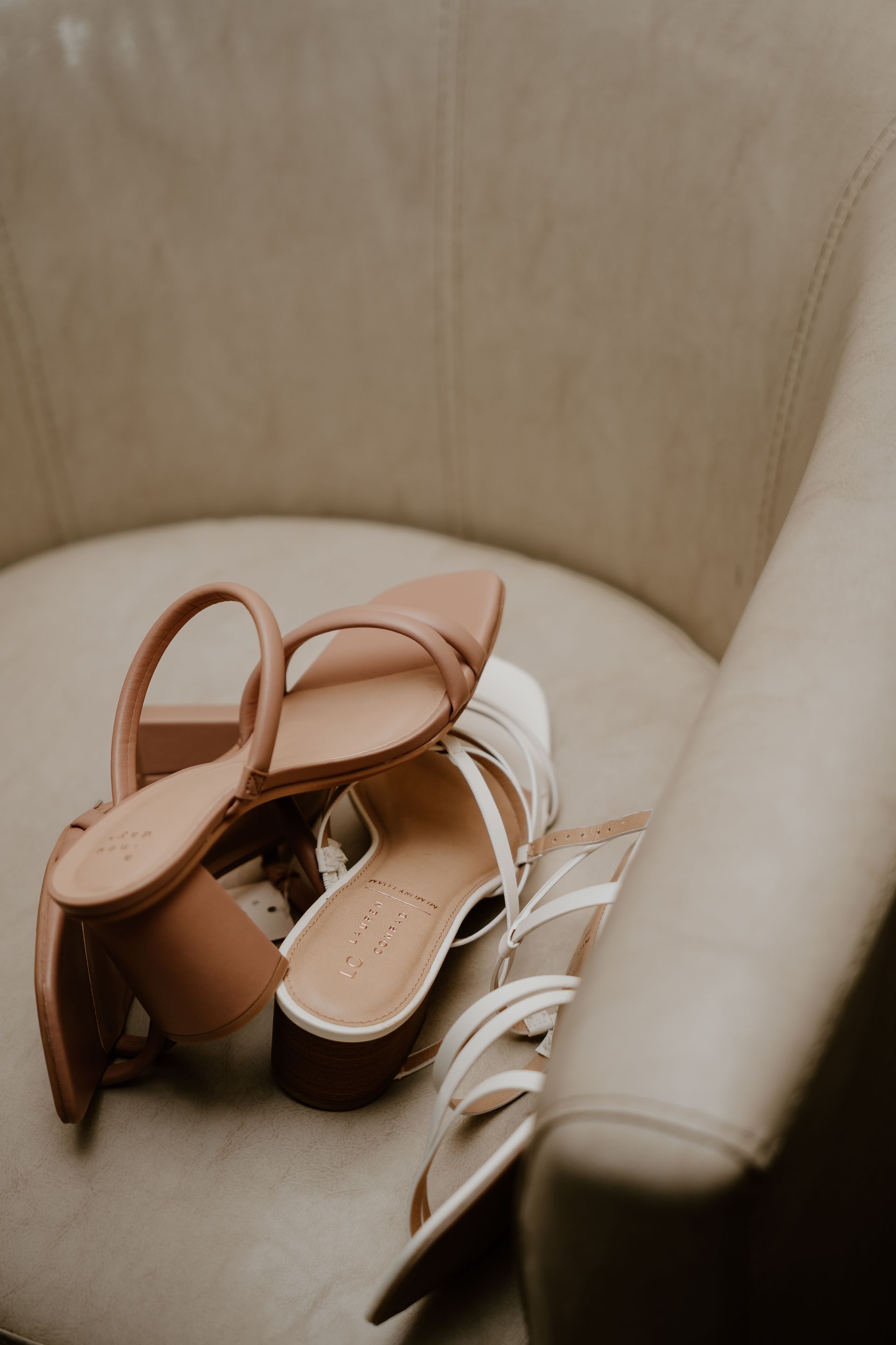 A pair of shoes are sitting on a chair.