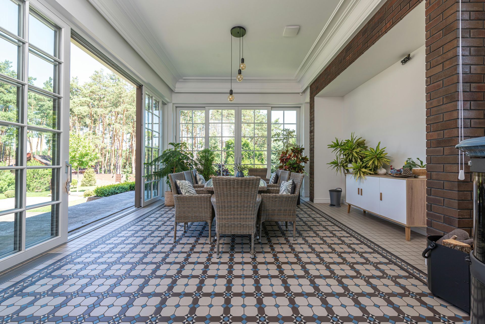 A large room with a dining table and chairs in it.