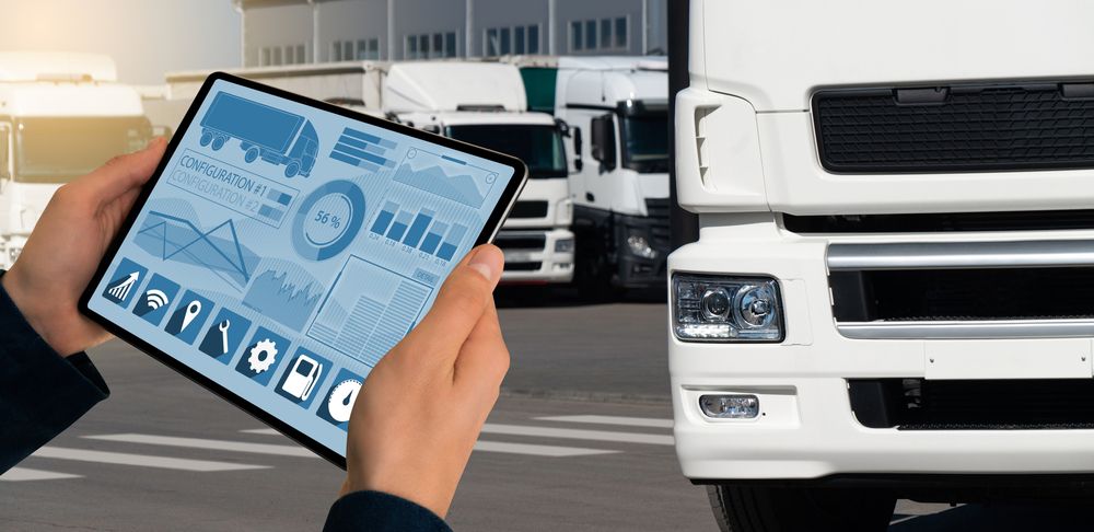 A Person is Holding a Tablet in Front of a Truck — Blue Orchid Accounting In Woongarrah, NSW