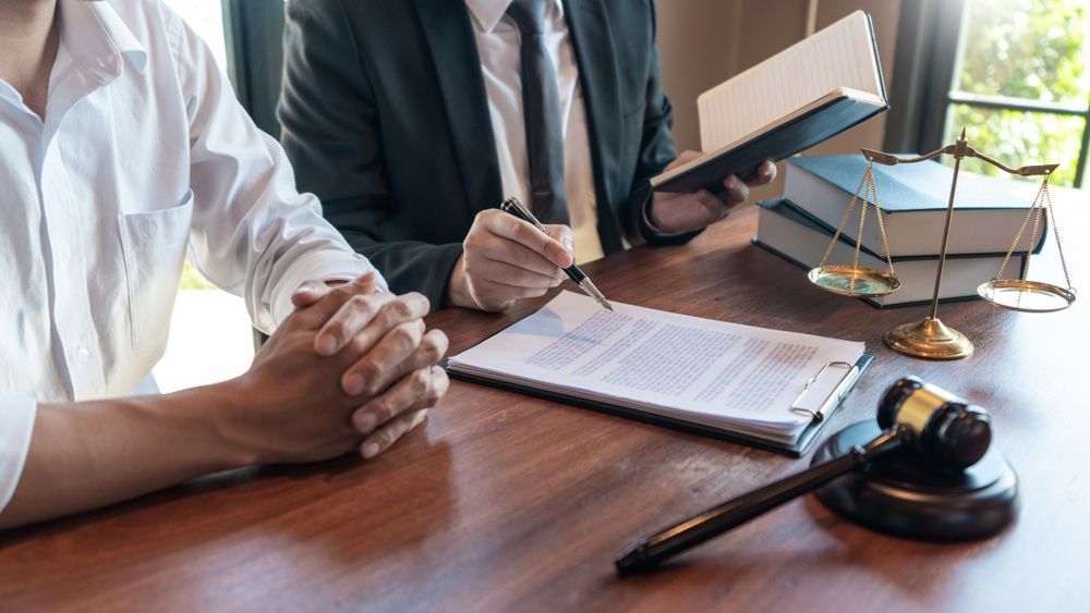 Lawyer Discussing About NDIS Claims with Client