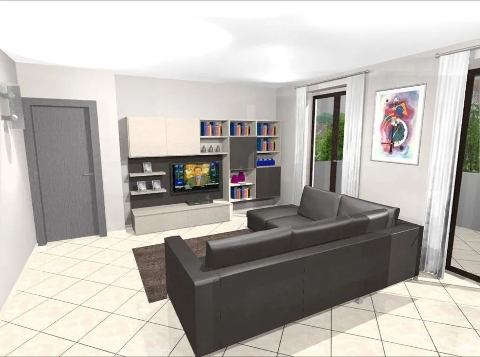 Interno del soggiorno con divano componibile grigio, TV, librerie e opere d'arte astratte.