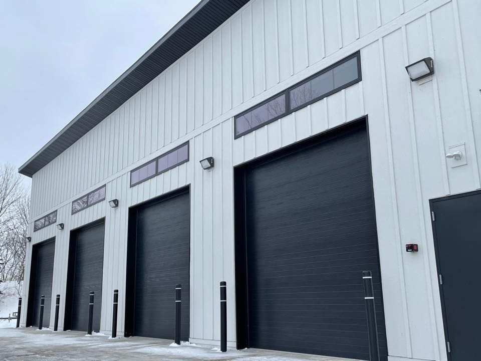 Commercial Building With Black Doors — Appleton, WI — American Overhead Door Commercial Building With Black Doors — Appleton, WI — American Overhead Door