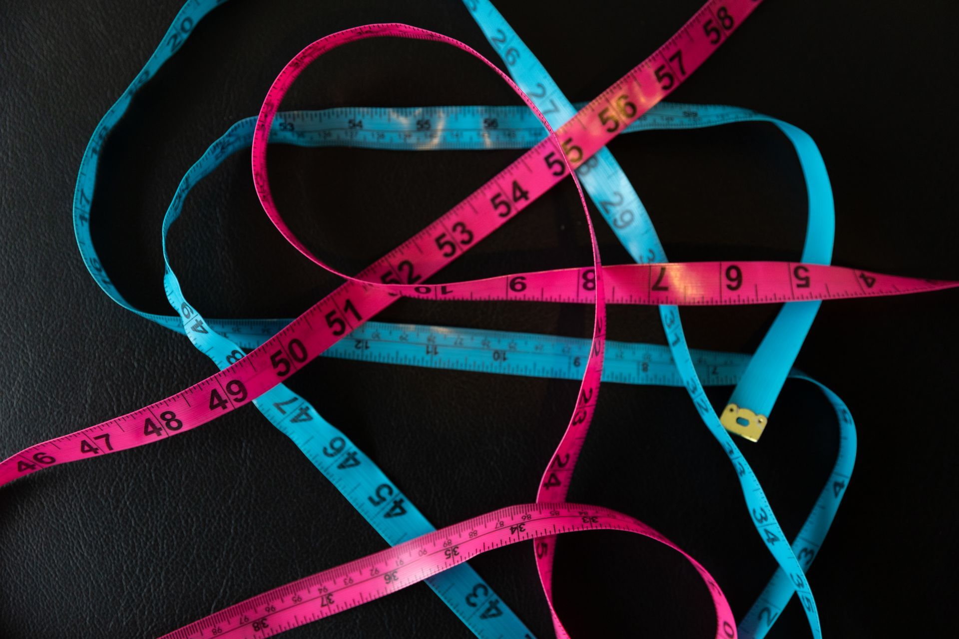 Blue and pink measuring tape