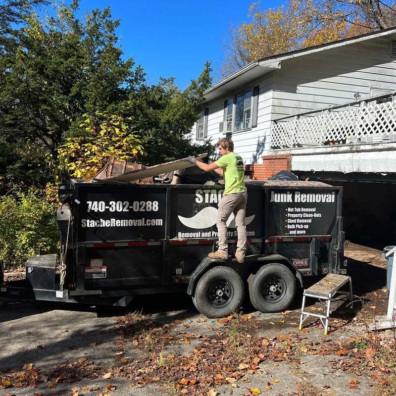Stache loading truck with hoarder junk, hoarding trashouts