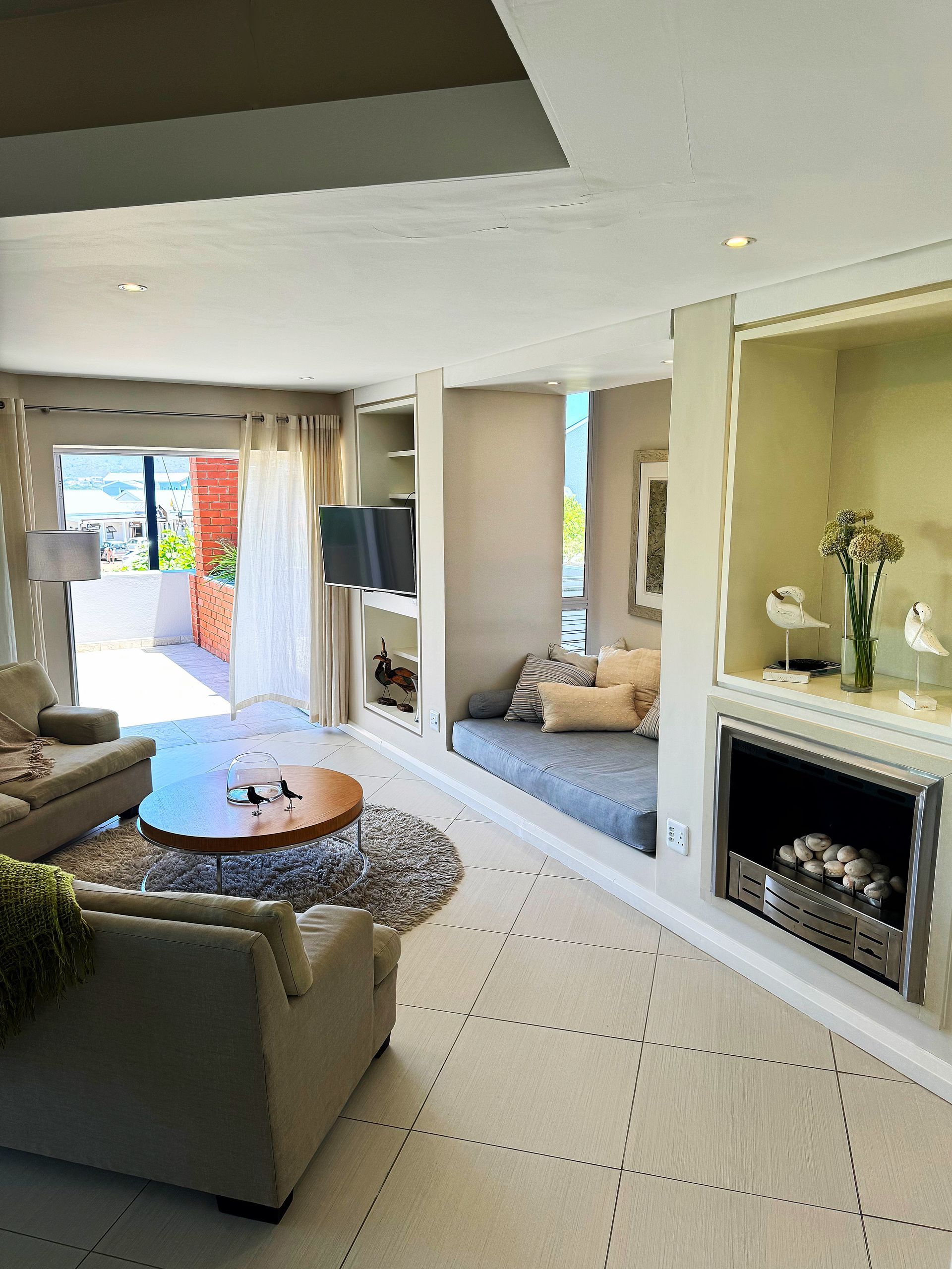 A living room filled with furniture and a fireplace