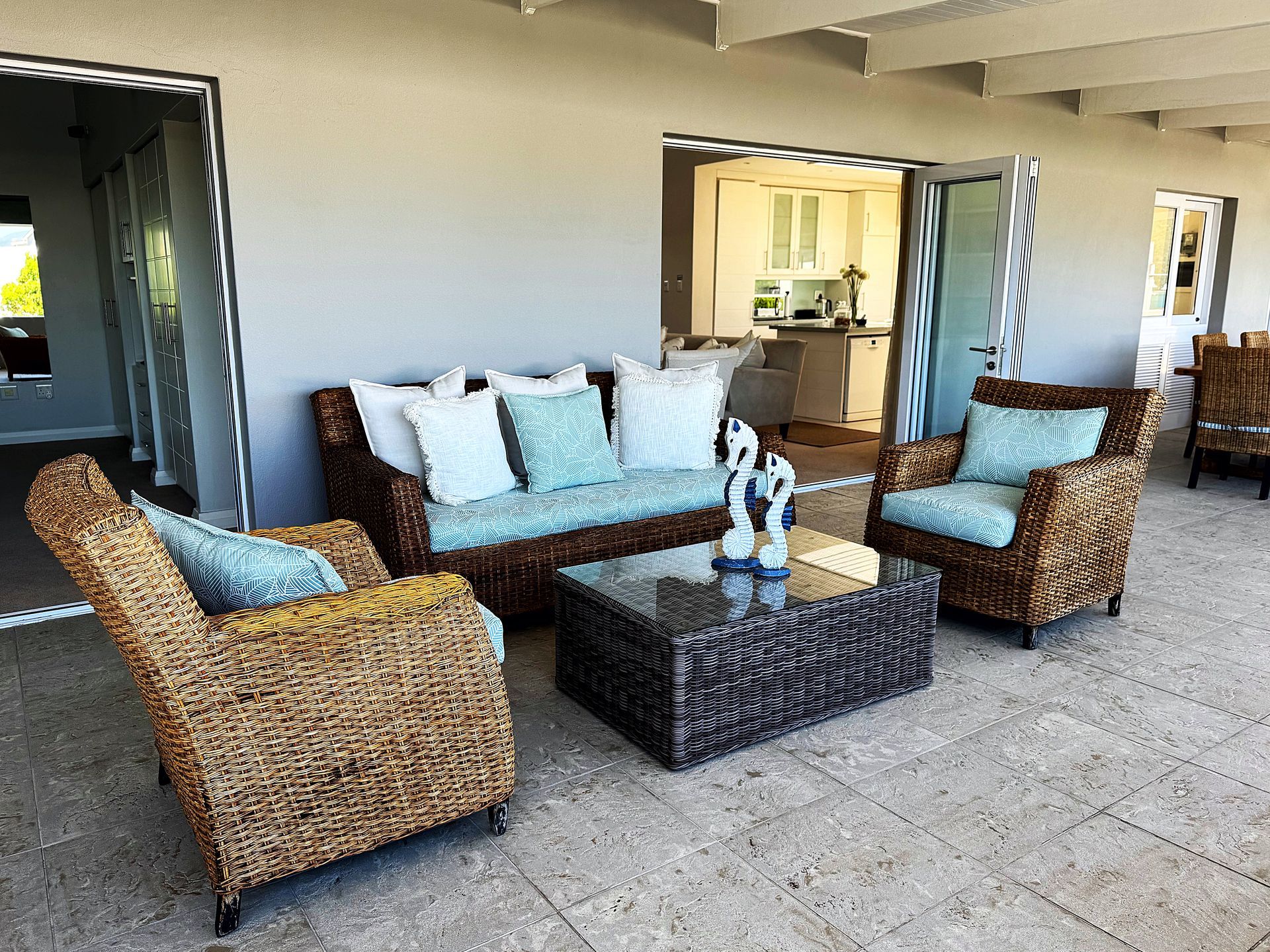 A living room with wicker furniture and a coffee table