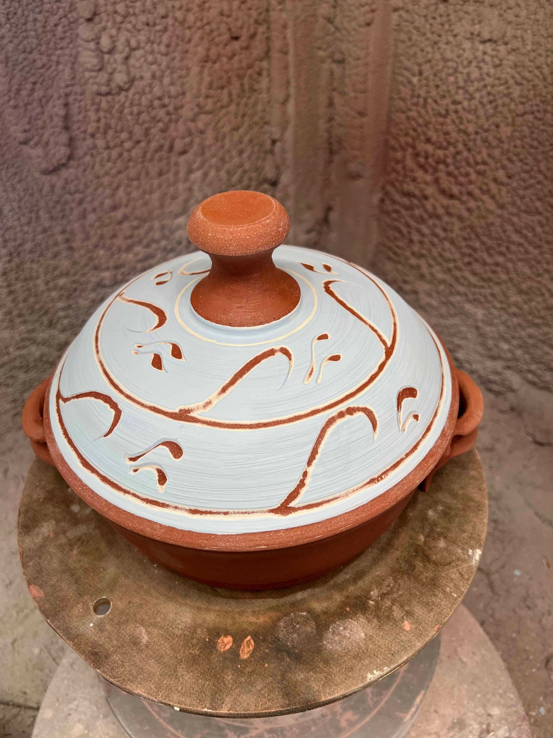 Blue and red terracotta pot lid