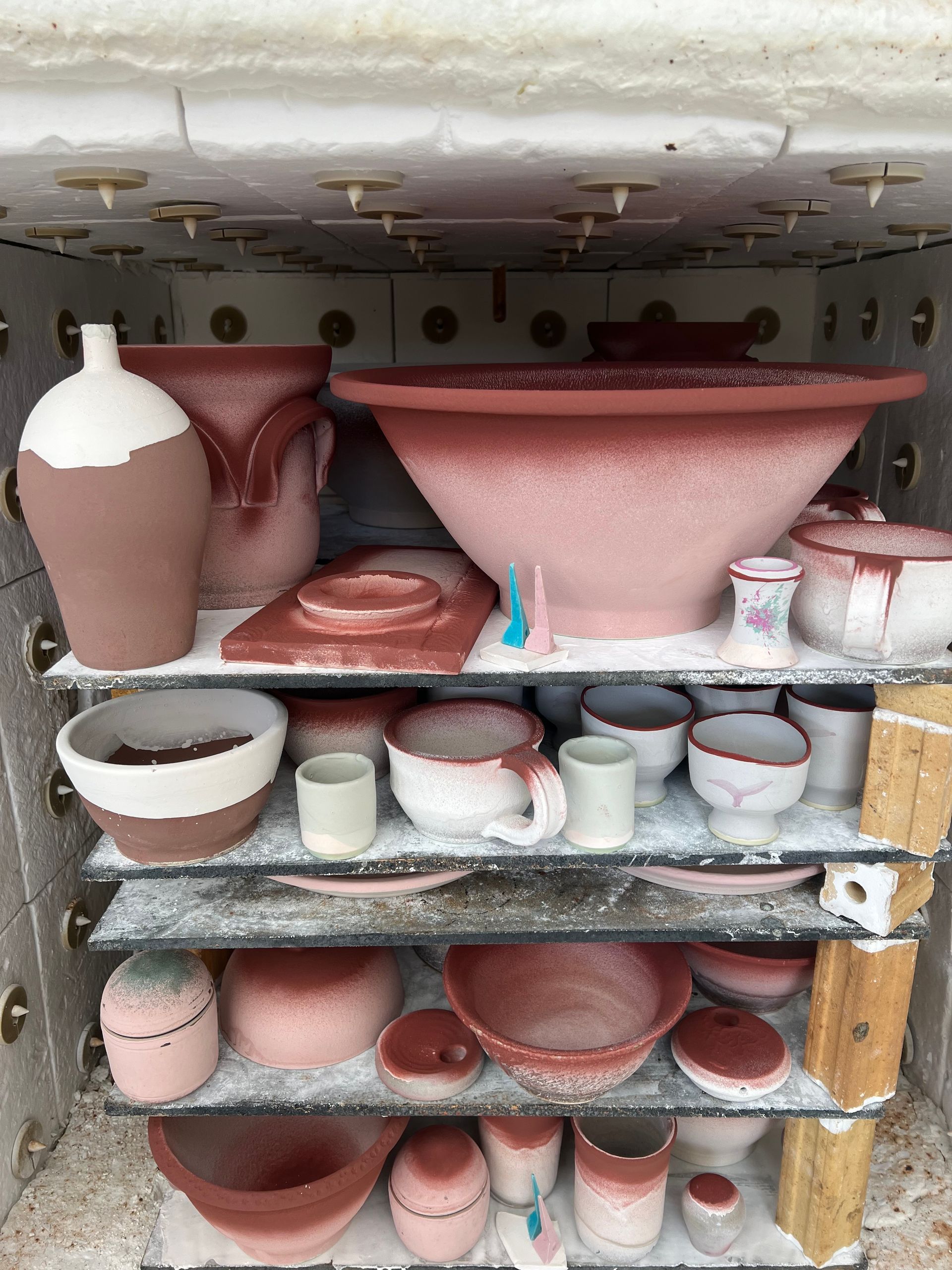 A Kiln full of pottery pieces that are ready to be fired.