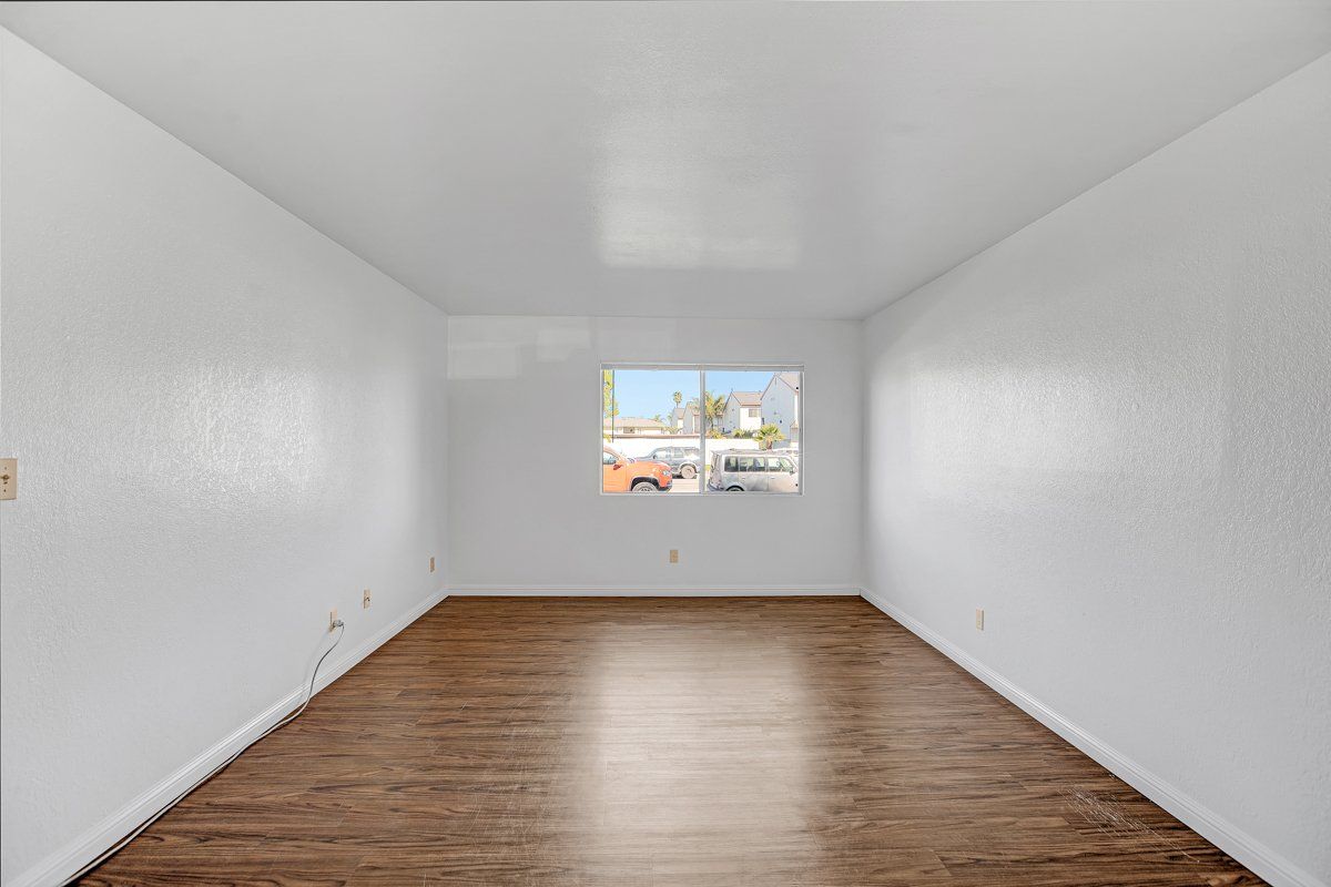 Room with hardwood floors and window