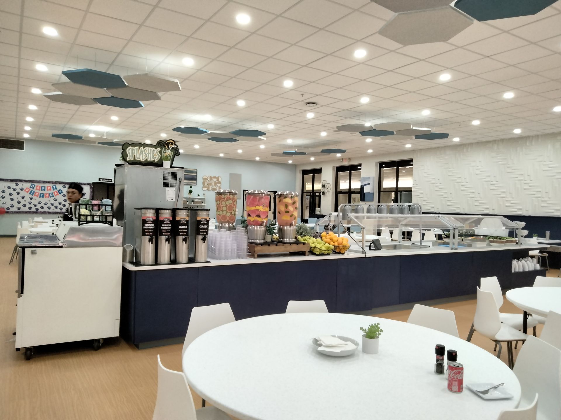 A large room with a lot of counters and tables.