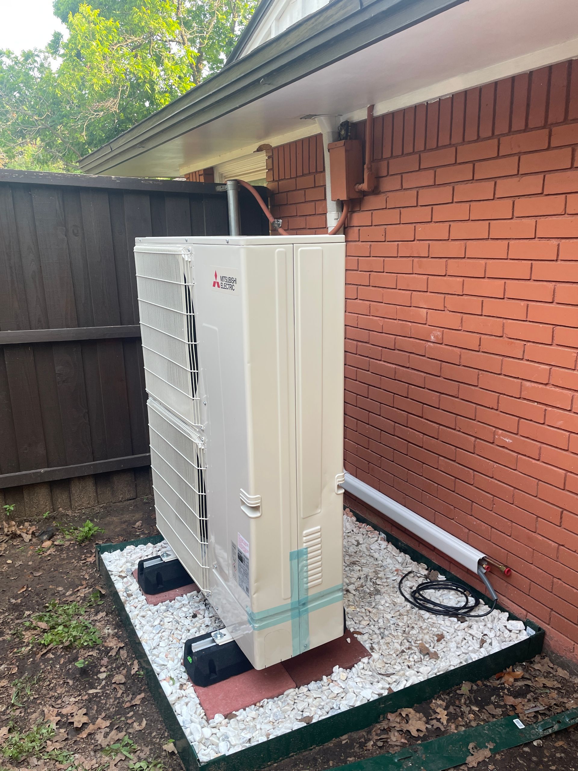 A living room with a chair and a radiator next to a window.