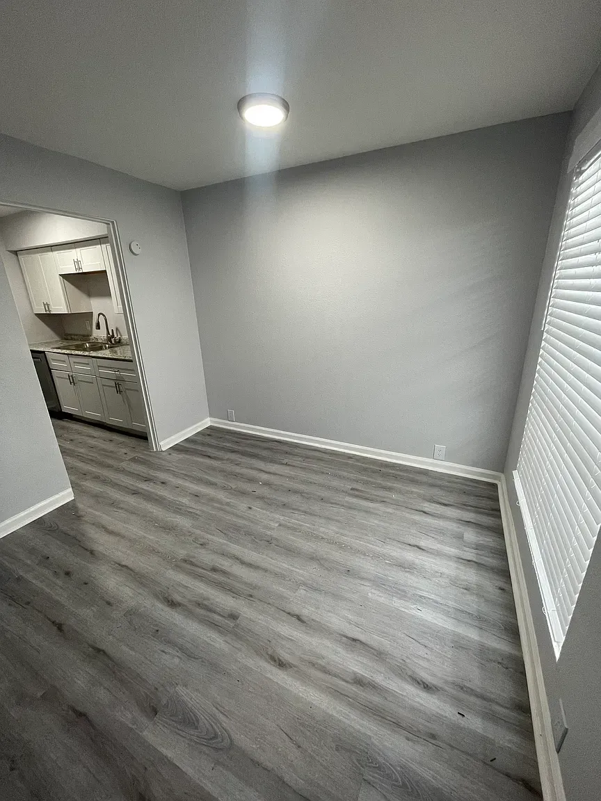 Photo of a small dining room area, connecting to the kitchen