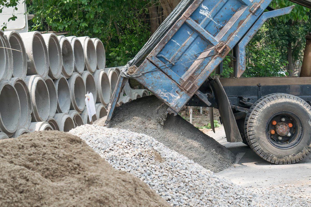 Dump truck unloading sand — North Kingsville, OH — Simak Trucking & Excavating, Inc.