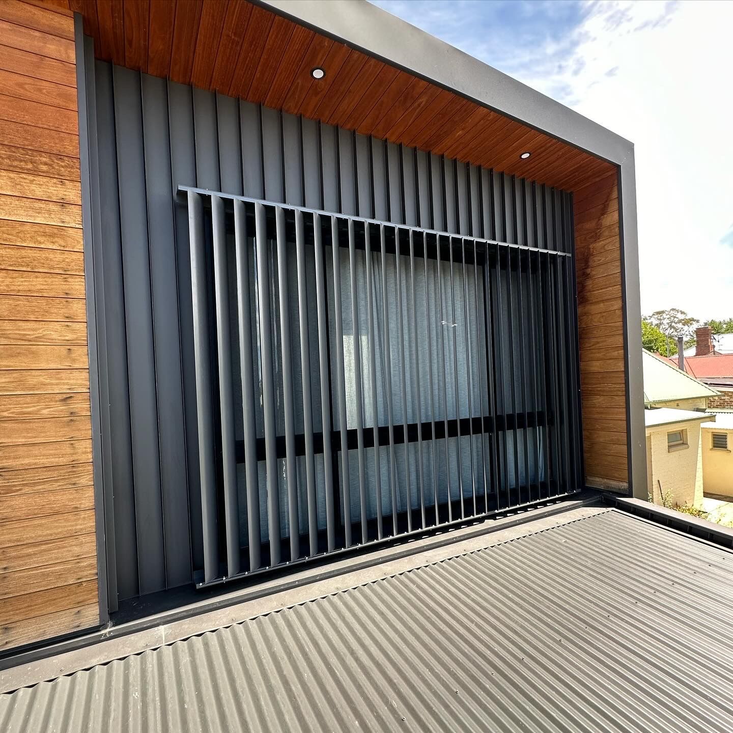 Modern building exterior with gray corrugated walls — LD Carpentry in Goulburn, NSW