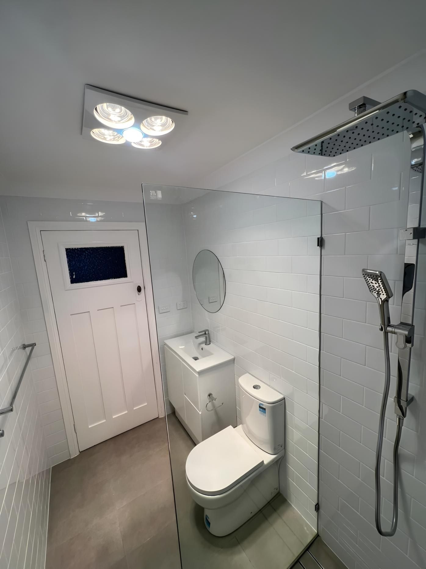 Modern White Bathroom With a Toilet — LD Carpentry in Bowral, NSW