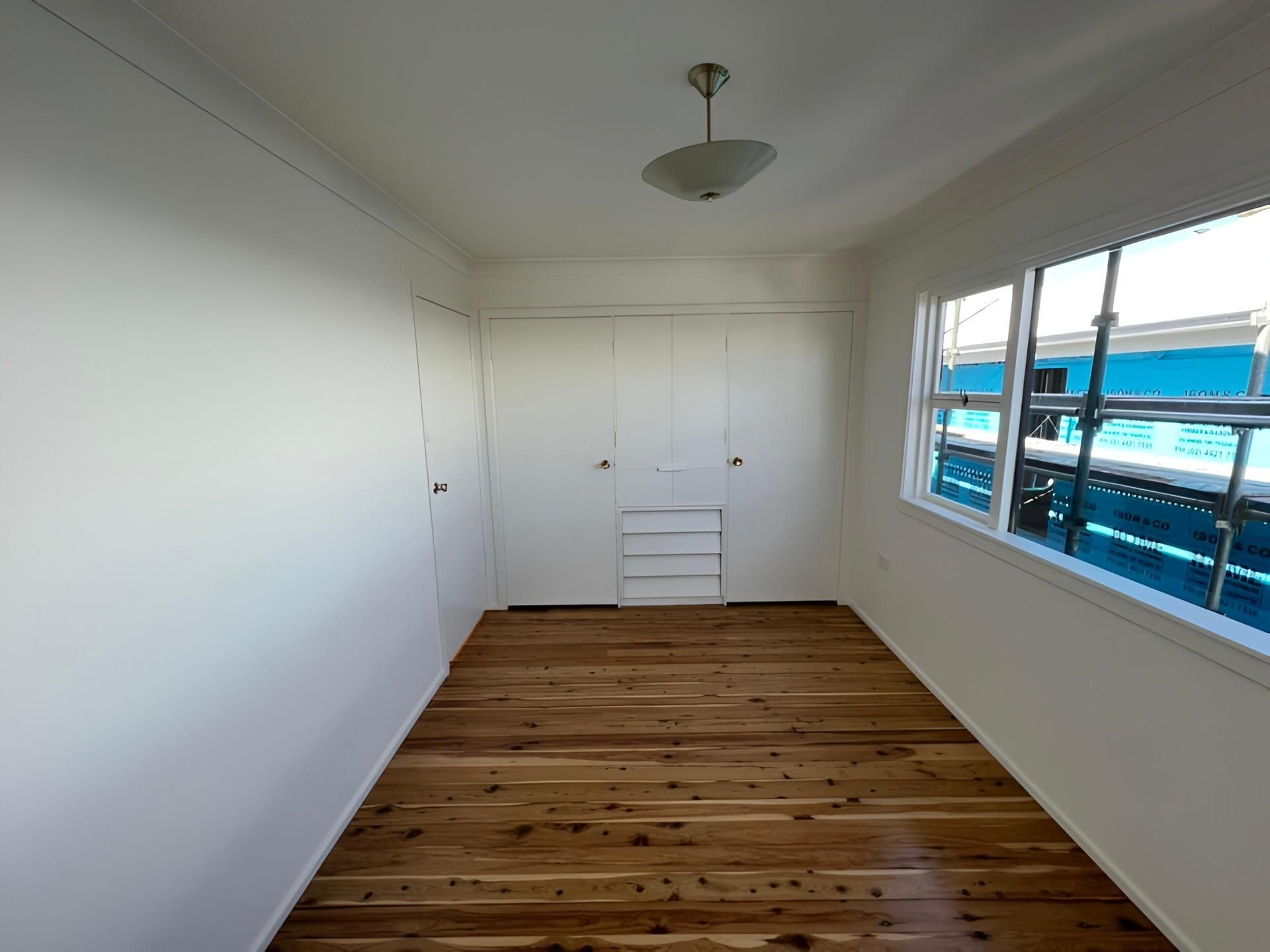 Empty Room With Wooden Floor — LD Carpentry in Queanbeyan, NSW