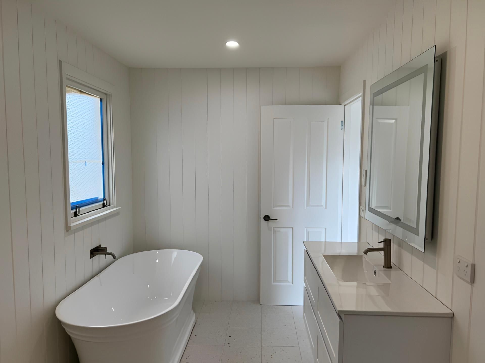 White Bathroom With a Soaking Tub — LD Carpentry in Moss Vale, NSW
