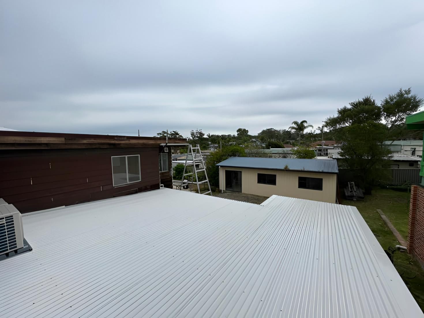 White Corrugated Roof, Brick Building — LD Carpentry in Bowral, NSW