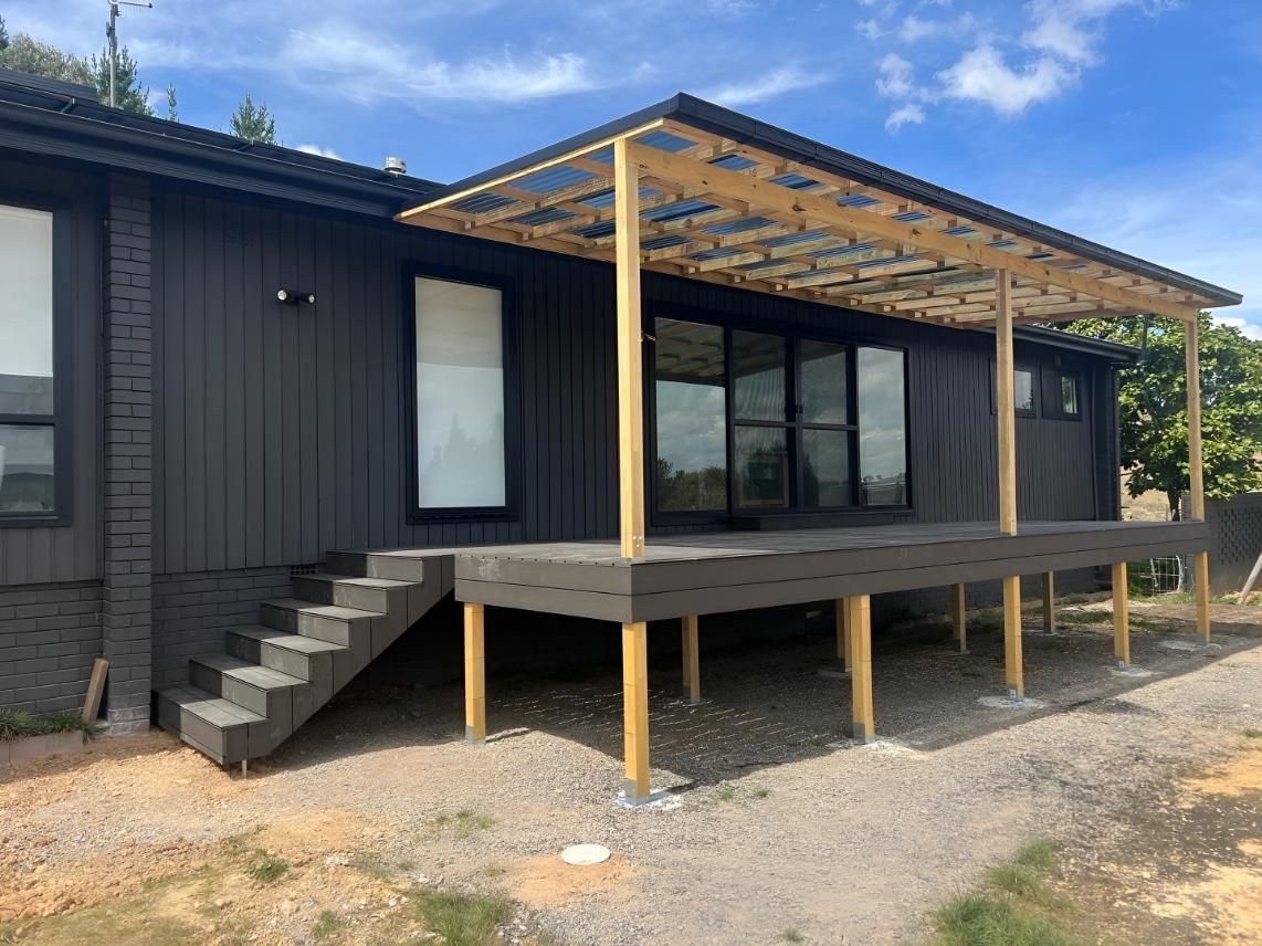 Dark-coloured House With a Wooden Deck — LD Carpentry in Queanbeyan, NSW