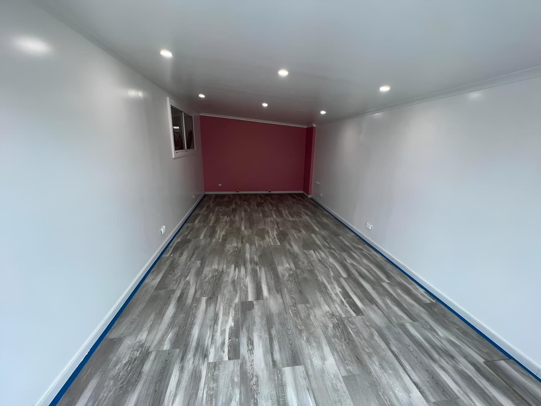 Empty, Rectangular Room With Gray Wood-look Flooring — LD Carpentry in Moss Vale, NSW