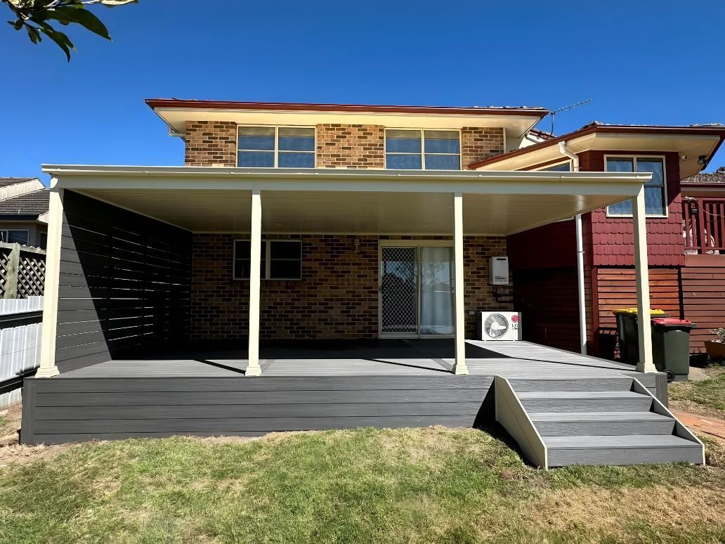 Two-story Brick Home With a Gray Deck — LD Carpentry in Canberra, ACT