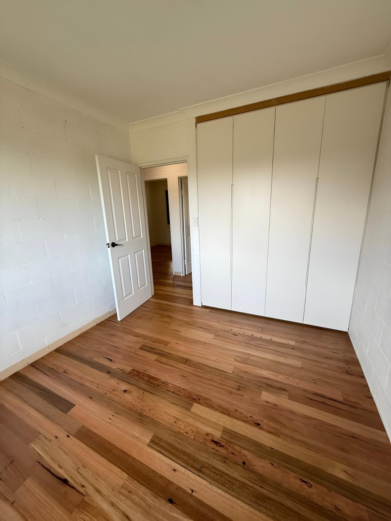 Wooden Floor, White Doors, and a Closet — LD Carpentry in Goulburn, NSW