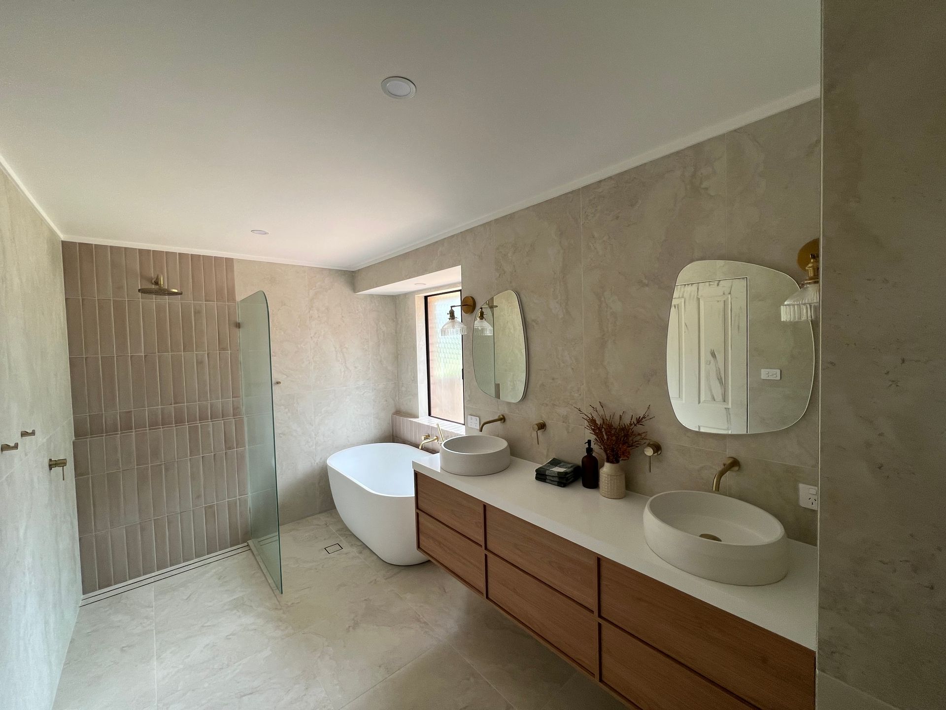 Spacious bathroom with a freestanding tub, dual sinks, and a shower — LD Carpentry in Goulburn, NSW