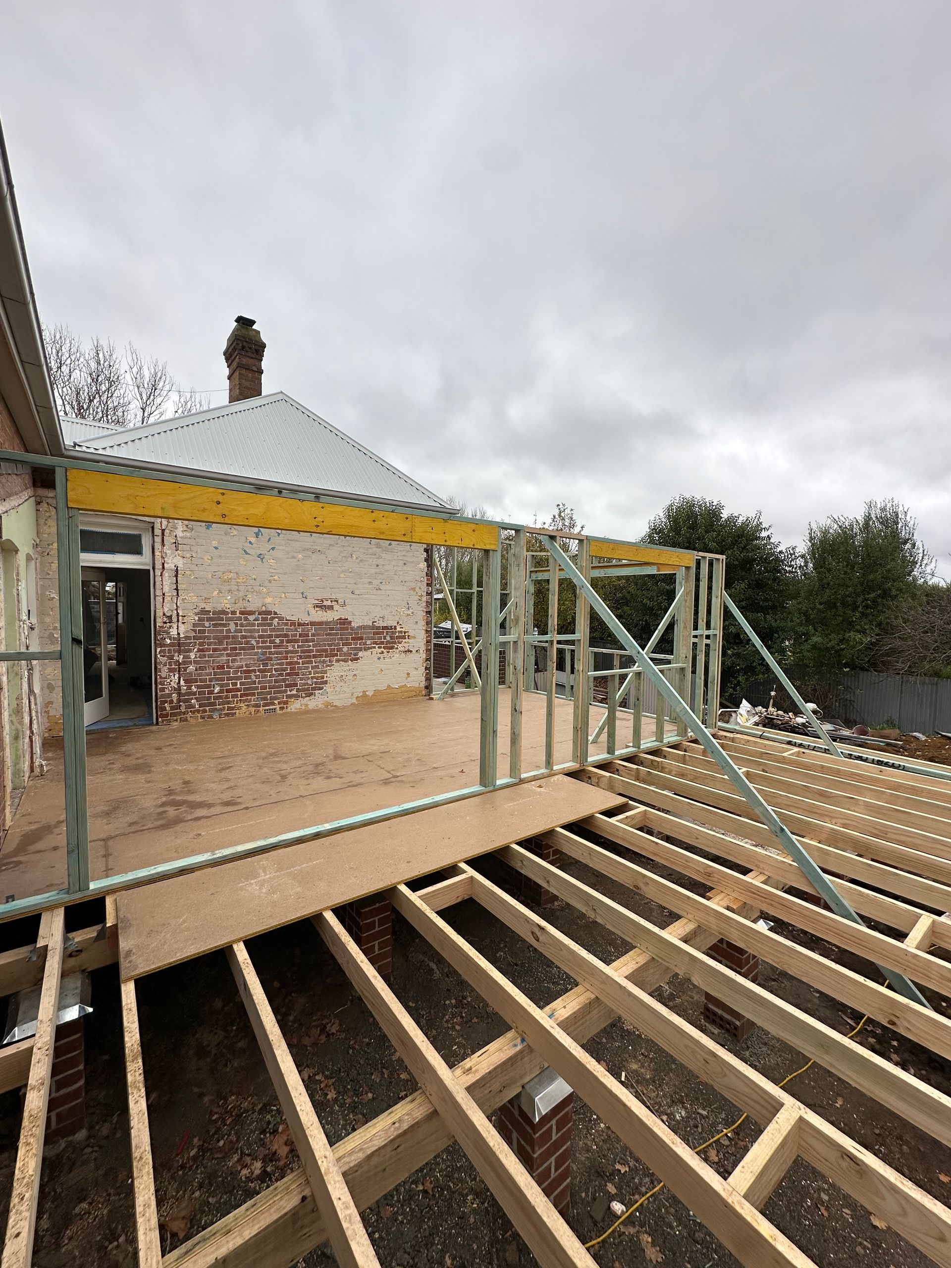 Construction of a rooftop deck with wooden frame and brick wall — LD Carpentry in Goulburn, NSW